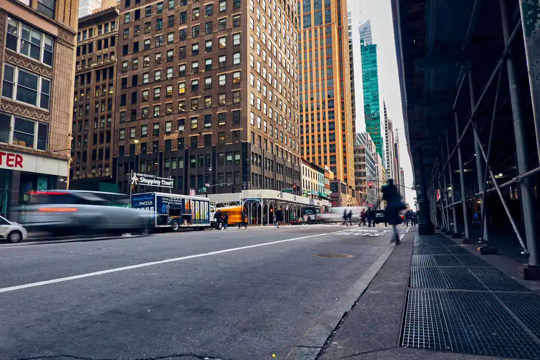 view city street buildings with blurred rear view walking women