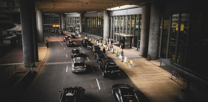 cars queue at airport drop off