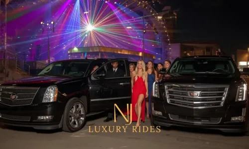 a black Cadillac Escalade parked outside a glowing New Jersey event venue at night