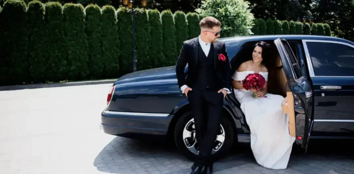 Bride and groom arriving at New Jersey wedding venue in professional transportation